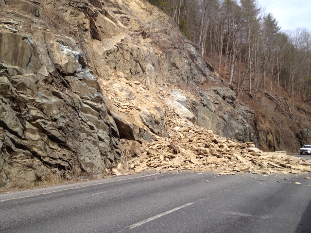 Rockslide near Mile Marker 7 on I-40 West in North Carolina showing large boulders and rock debris covering the highway