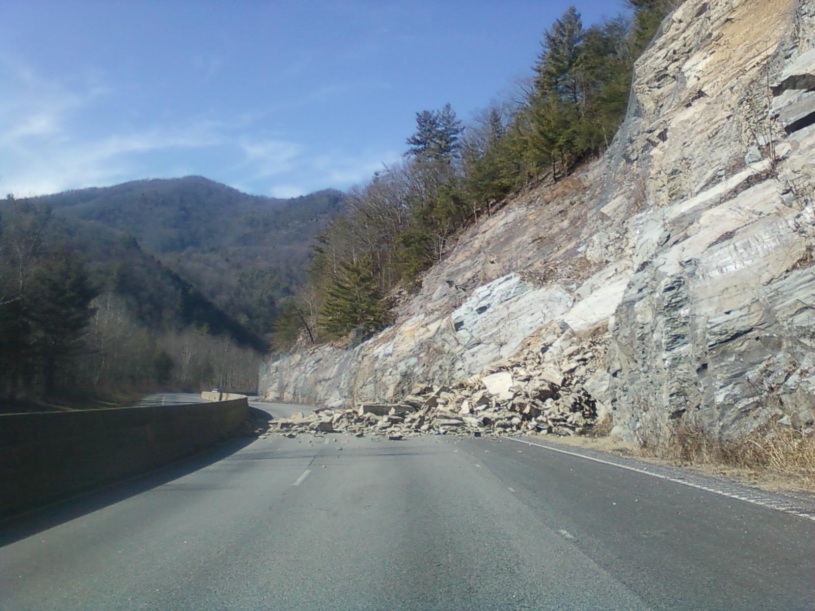 Rockslide near Mile Marker 7 on I-40 in North Carolina showing large boulders and debris on the highway