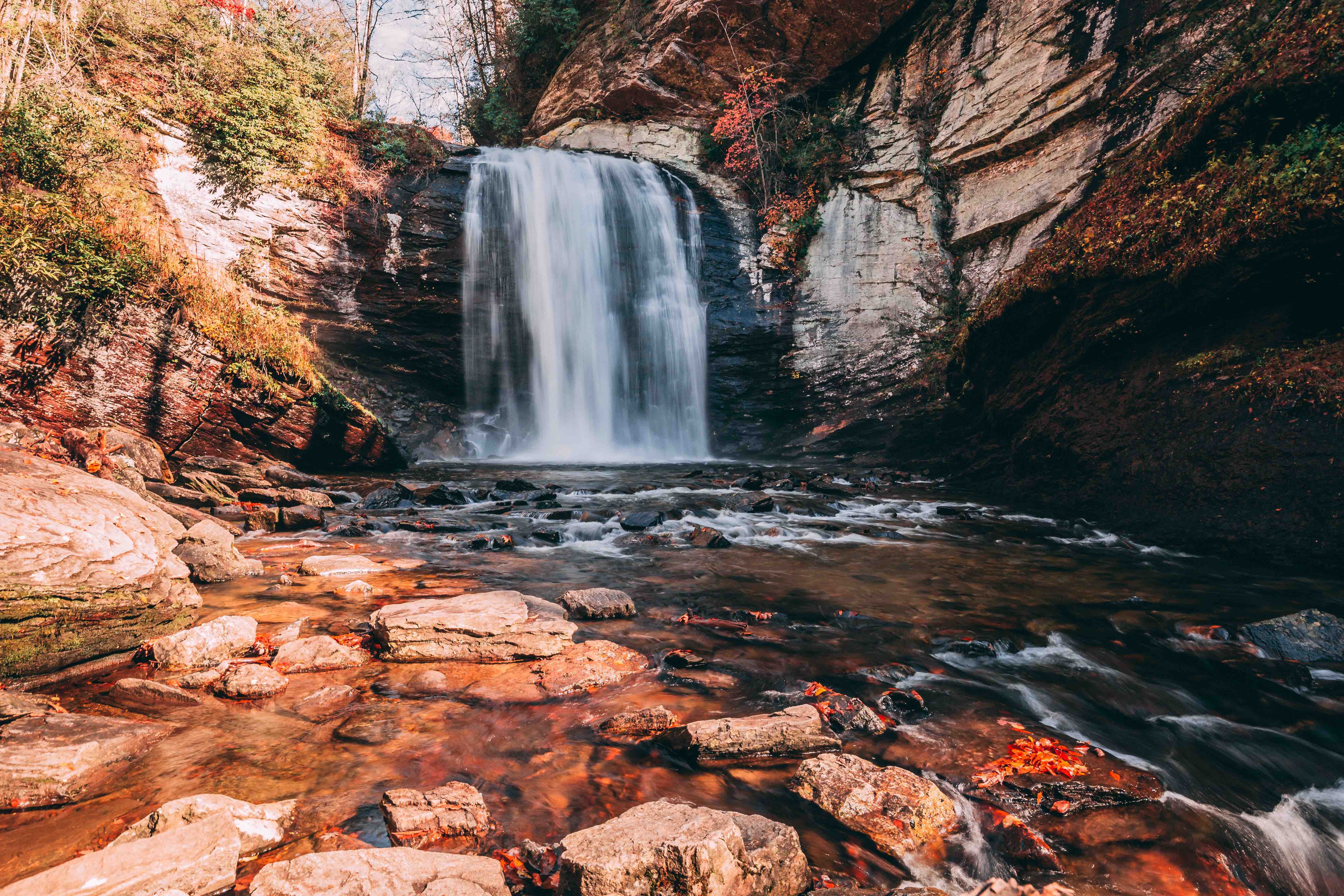 A waterfall surrounded by lush green vegetation in Western North Carolina